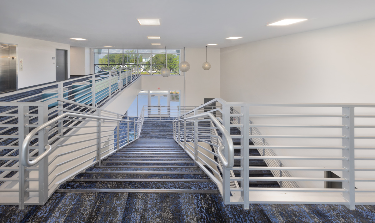 Interior design lobby staircase view of the College of the Florida Keys in Key Largo, FL.